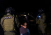 Viral Courthouse Arrest Sparks Records Blackout Two armed officers detaining person at night