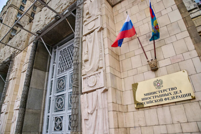 ministry-of-foreign-affairs-of-russia-building2312303563jpg Russian ministry building entrance with ornate metal door and flags