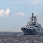 Nuclear Navy? Kim Dares The World Large gray naval warship sailing on open water