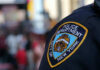 NYPD officer uniform badge closeup in NYC