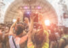 Data Center Backlash EXPLODES in Coachella Crowd at a music festival with hands raised in celebration