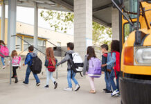 Demographic Earthquake Hits U.S. Classrooms Group of children walking towards a school bus