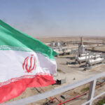 Trust Iran? General Says Think Again Iranian flag waving in front of an oil processing facility