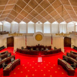 Mortgage Crackdown Hype? Loophole Already Closed Interior view of a legislative chamber with red carpet and wooden accents