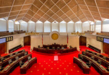 Mortgage Crackdown Hype? Loophole Already Closed Interior view of a legislative chamber with red carpet and wooden accents