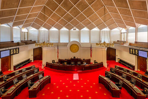 Raleigh,,North,Carolina,-,December,11:,Senate,Chamber,In,The Interior view of a legislative chamber with red carpet and wooden accents