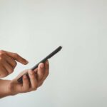Data-Free Panic Pushes Parents Aside Person using a smartphone with one hand