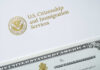 USCIS letterhead with Department of Homeland Security seal and partial naturalization certificate