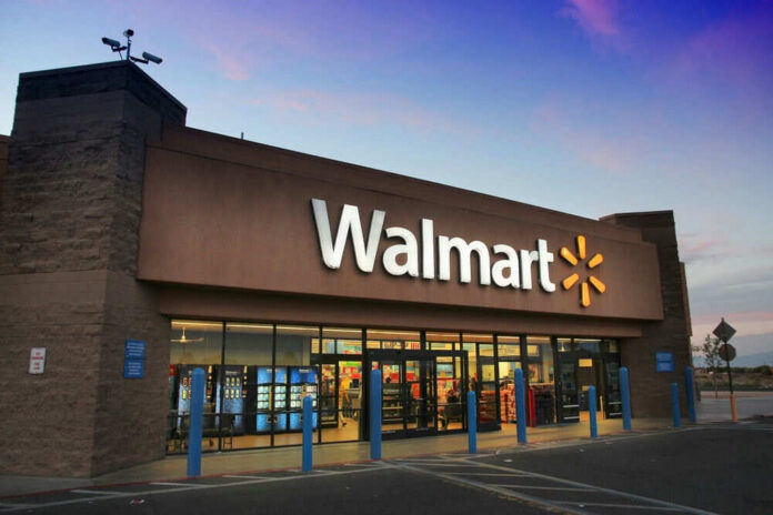walmart2396112847jpg Walmart storefront at dusk with lit signage