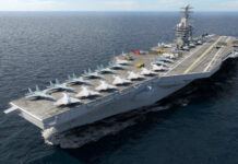 Navy Killed Its Best Dogfighter—In 48 Hours Aircraft carrier sailing at sea with jets lined up on the flight deck