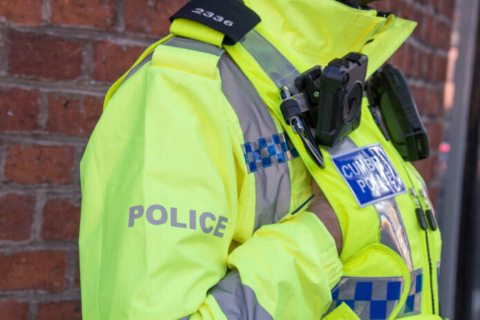 british-police-officers1525557920jpg Police officer in high-visibility jacket with body camera