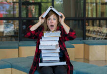 Court Slaps Down DeSantis’ Classroom Crackdown Person balancing books on head, looking surprised.