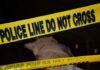 Couch Corpse Stuns Brooklyn Police tape and covered figure at crime scene