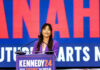 Endorsement Claim BLOWS UP In Florida Woman in purple blazer speaking at a podium on stage