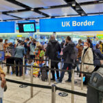 Terror Suspects Sailed Through Canada’s Gate Travelers queue at UK border control in an airport