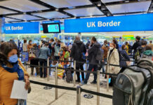 Terror Suspects Sailed Through Canada’s Gate Travelers queue at UK border control in an airport