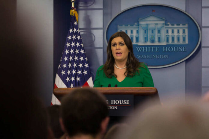 Woman at a White House press briefing podium