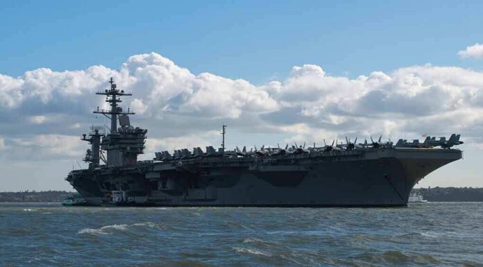 Aircraft carrier at sea with fighter jets on deck