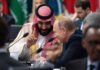 Hormuz Deal: Tiny Patch, Huge Stakes Two delegates converse at an international summit table