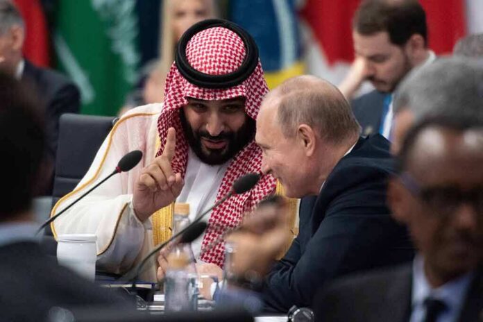 shutterstock_1369295234 Two delegates converse at an international summit table