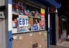 Convenience store window with EBT and ATM signs