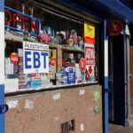 Convenience store window with EBT and ATM signs