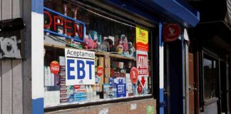 Convenience store window with EBT and ATM signs