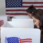 DMV Glitch Quietly Warps NJ Elections Voters at polling booths with American flag in background