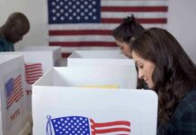 DMV Glitch Quietly Warps NJ Elections Voters at polling booths with American flag in background