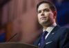 Rubio’s Terror Flip Sparks Global Uproar man in suit speaking at podium