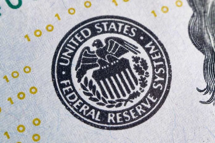 Macro,Photo,Of,Federal,Reserve,System,Symbol,One,Hundred,Dollar Federal Reserve seal on U.S. currency