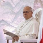 July 4 Twist: Pope Skips America Pope seated in a ceremonial chair with flags in the background