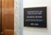 Committee on the Judiciary hearing room sign on wall