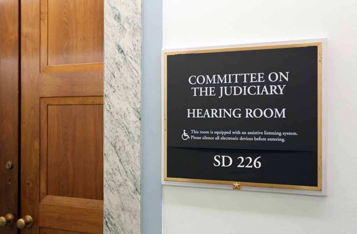 Committee on the Judiciary hearing room sign on wall