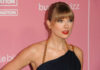 Swift Wedding? NYC Bends Rules Quietly Woman with bangs in black dress on pink backdrop