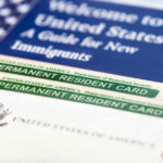 U.S. permanent resident cards with immigration guide and flag