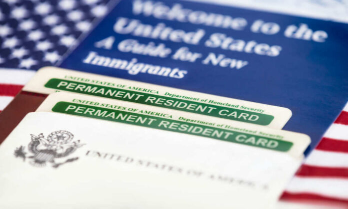 usa-permanent-resident-cards232231384jpg U.S. permanent resident cards with immigration guide and flag