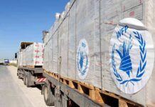 Humanitarian aid trucks loaded with palletized supplies