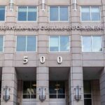 Army Family Shattered — Wife Vanishes US government building facade with flags and number 500