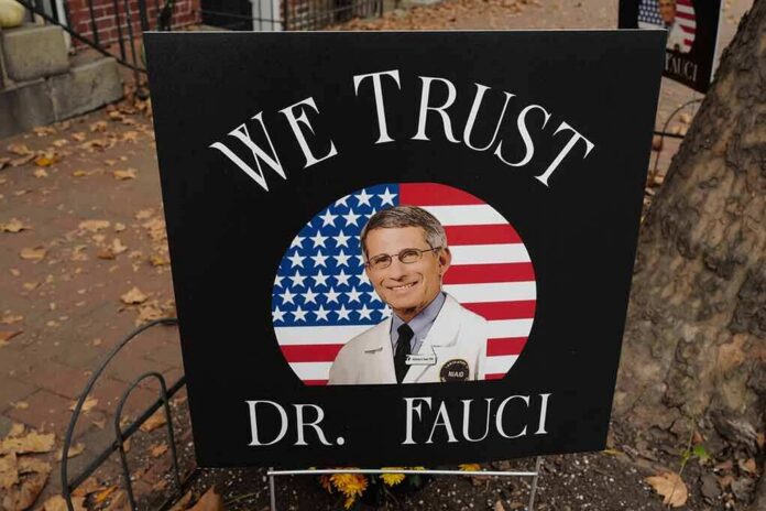 shutterstock_1840078672-1 yard sign with portrait of a doctor over a U.S. flag