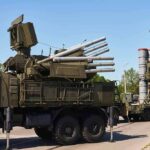military air defense vehicles on a road