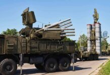 China Slams Door on Surplus Arms military air defense vehicles on a road