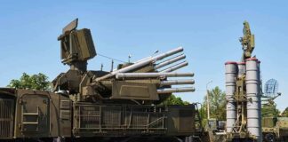 military air defense vehicles on a road