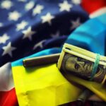 Ukraine Aid Faces Scrutiny, But Theft Unproven U.S. and Ukrainian flags with cash roll and bullet casings