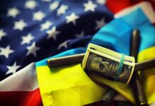 U.S. and Ukrainian flags with cash roll and bullet casings