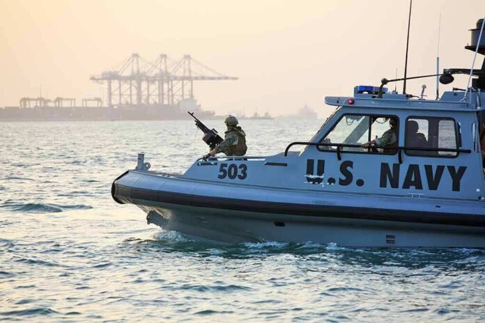 U.S. Navy patrol boat with armed crew on the water
