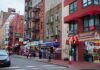 Map Snub Explodes: Little Italy Missing City street with brick buildings, fire escapes, and busy storefronts