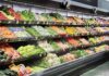 Taco Bell Lettuce Tied To Massive Illness Grocery store produce aisle with stacked fresh vegetables