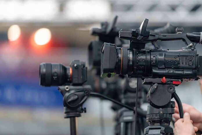 Professional video cameras on tripods