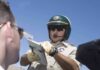 Police officer issues a traffic ticket to a driver